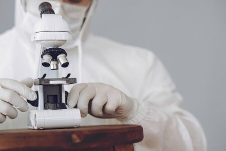 Man in protective suit and glasses in studioの写真素材