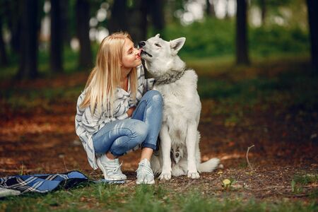 Elegant and stylish girl in a summer forestの写真素材