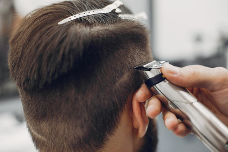 Stylish man sitting in a barbershop