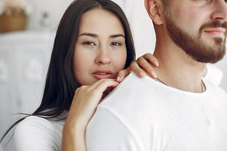 Beautiful couple spend time in a bedroom