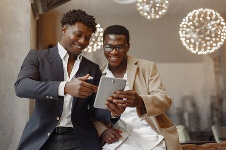 Black men in a cafe have a businessの写真素材