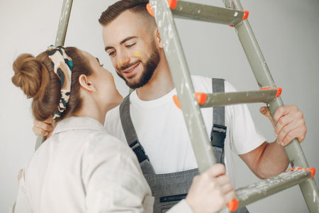 The young and cute family repairs the room