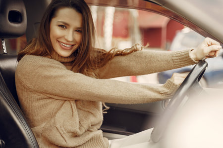 Elegant businesswoman sitting in a car