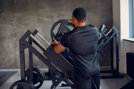 A handsome black man is engaged in a gym
