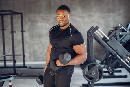 A handsome black man is engaged in a gymの写真素材