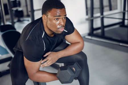 A handsome black man is engaged in a gymの写真素材
