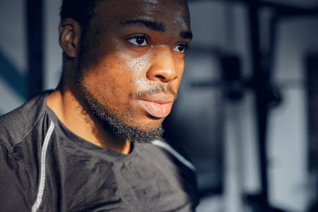 A handsome black man is engaged in a gym