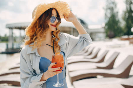 Beautiful and elegant girl on a resortの写真素材