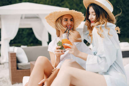 Two elegant girls on a resortの写真素材