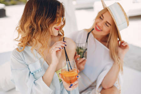 Two elegant girls on a resortの写真素材