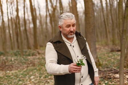 Elegant adult man in a spring forest