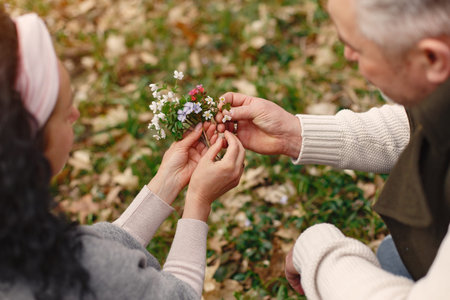 Elegant adult couple in a spring forestの写真素材