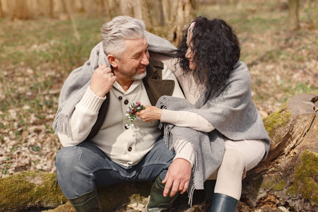 Elegant adult couple in a spring forest