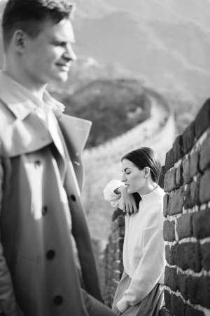 beautiful young couple posing at the Great Wall of Chinaの写真素材