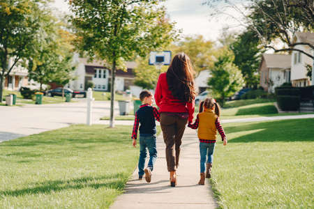 Beautiful mother with little kidsの写真素材