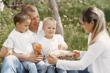 Cute family playing in a summer yard