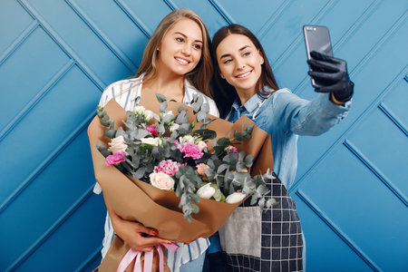 Frorist makes a beautiful bouquet in a studio