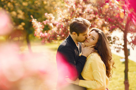 Beautiful couple spend time in a spring park