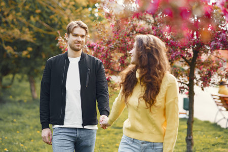 Beautiful couple spend time in a spring park