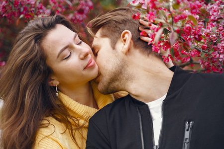 Beautiful couple spend time in a spring parkの写真素材