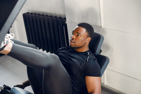A handsome black man is engaged in a gym