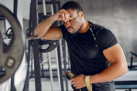 A handsome black man is engaged in a gymの写真素材