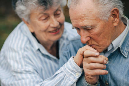 Beautiful old couple spent time together in a parkの写真素材
