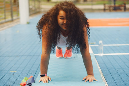 Over the size of a woman doing stretching exercises