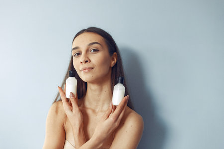 Beautiful girl standing in a studio with cream