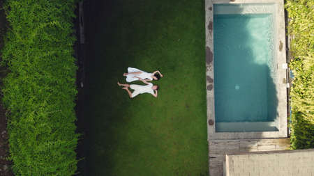 Couple lie on a graas on a Baliの写真素材