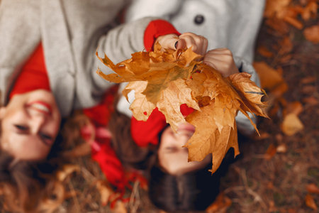 Cute and stylish family in a autumn park