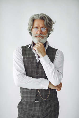 Handsome pensive mature businessman in formal suitの写真素材