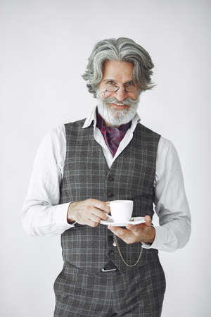 Handsome pensive mature businessman in formal suitの写真素材