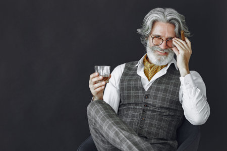 Handsome pensive mature businessman in formal suit