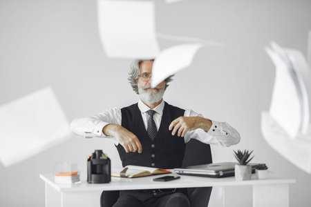 Handsome pensive mature businessman in the office