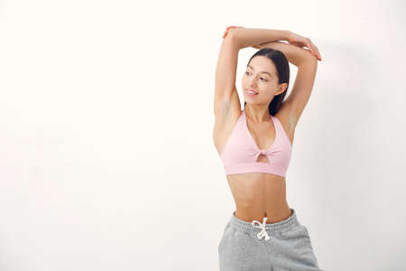 A beautiful girl is engaged in a yoga studioの写真素材