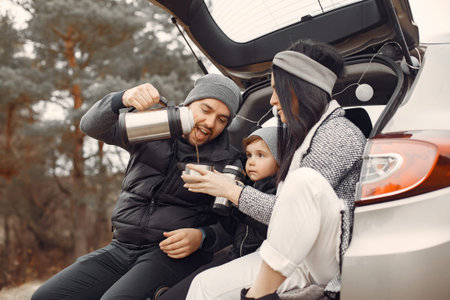 Cute family playing in a spring forest