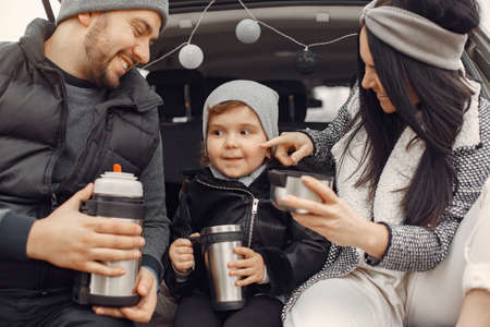 Cute family playing in a spring forestの写真素材
