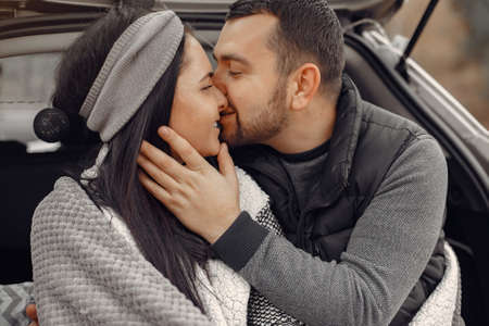 Beautiful couple spend time in a spring fieldの写真素材