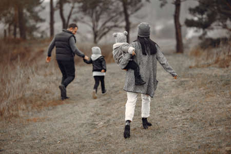 Cute family playing in a spring forestの写真素材