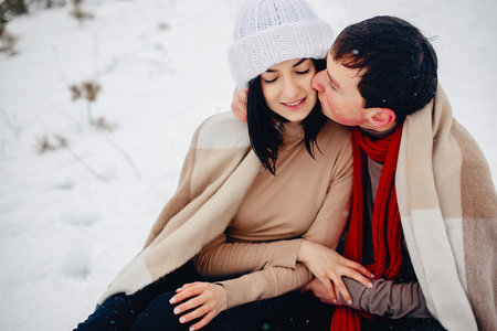 Loving couple walking in a winter park