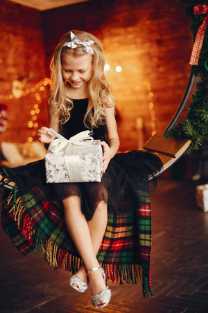 Little girl near in a black dressの写真素材