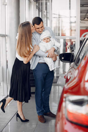 Family with little son in a car salonの写真素材