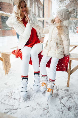 Cute and beautiful family in a winter cityの写真素材