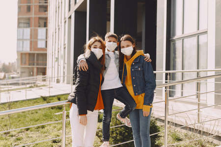 People in a mask standing on the streetの写真素材