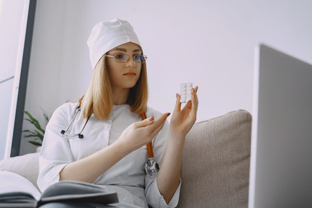 Woman doctor with white coat in hospital