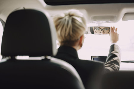 Businesswoman sitting inside a car