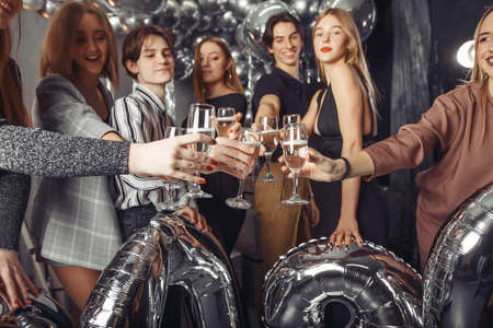 People celebrating a new year with a big ballonsの写真素材