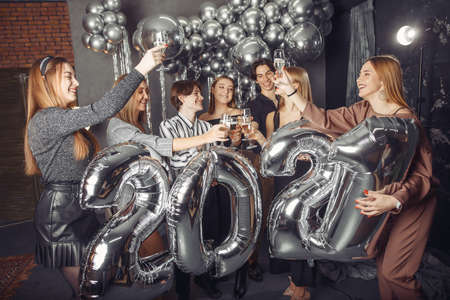 People celebrating a new year with a big ballonsの写真素材