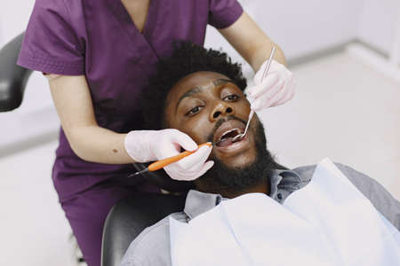 African patient in dentistry sitting in dental chairの写真素材